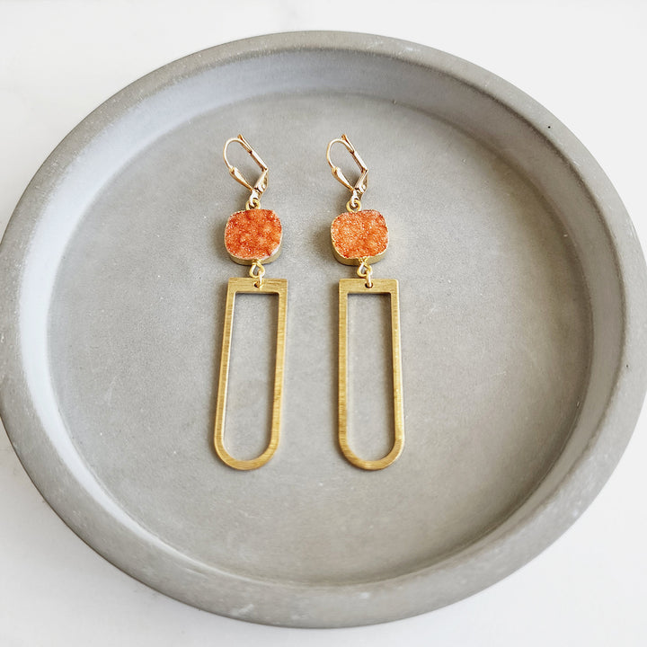 Long Horseshoe Dangle Earrings with Orange Druzy Stone in Brushed Brass
