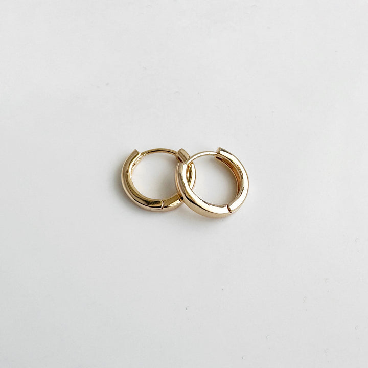 Tiny Round Huggie Earrings in 18k Gold