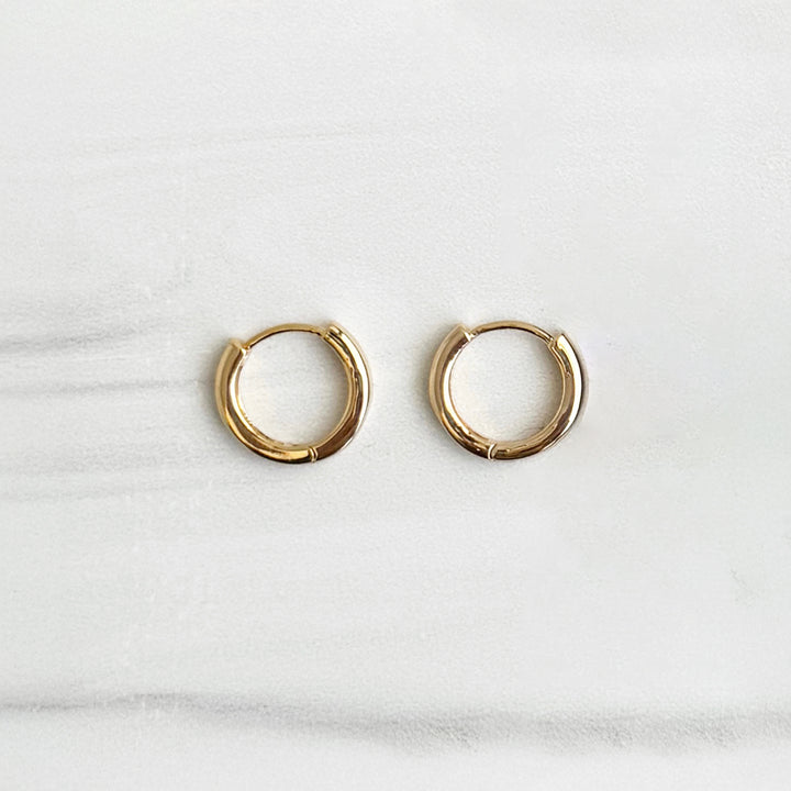 Tiny Round Huggie Earrings in 18k Gold