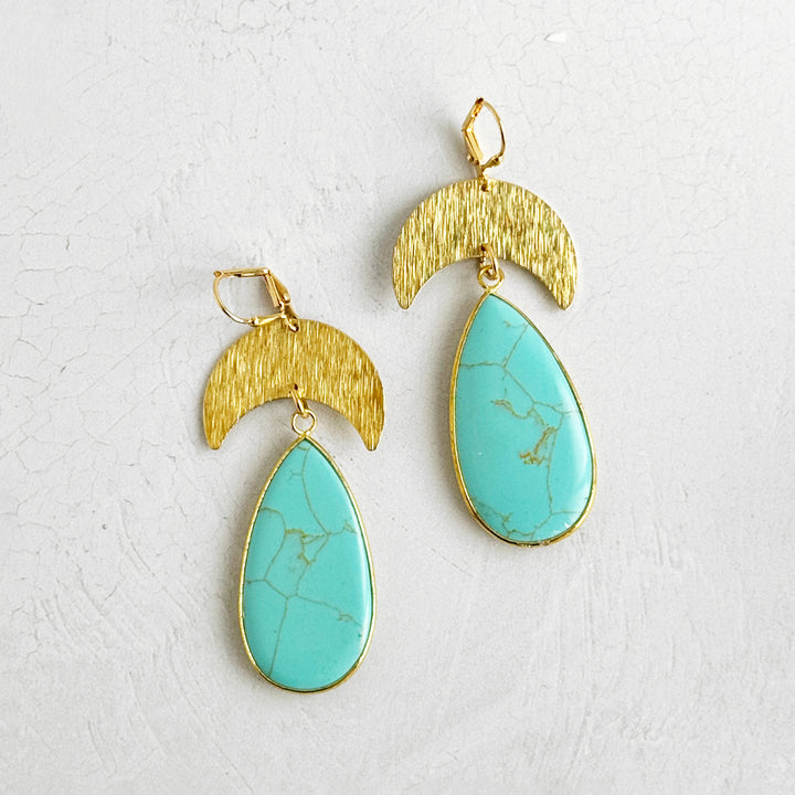 Large Turquoise Howlite Crescent Dangle Earrings in Brushed Gold
