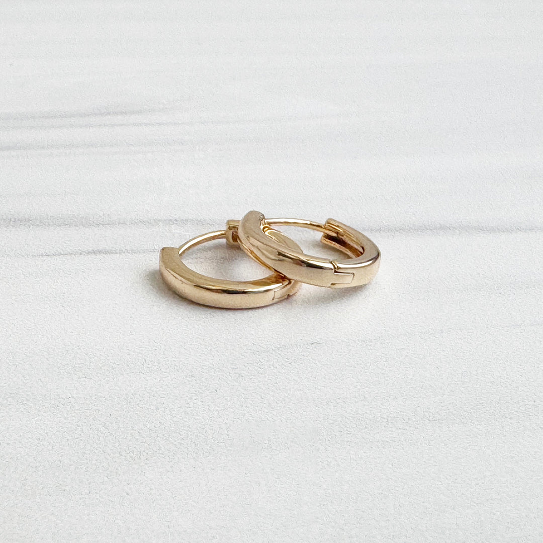 Tiny Round Huggie Earrings in 18k Gold