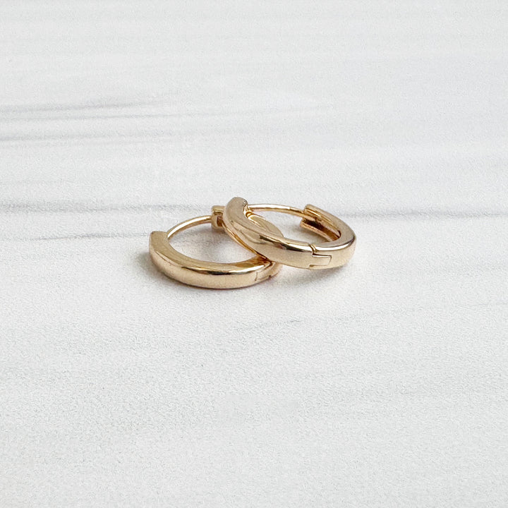 Tiny Round Huggie Earrings in 18k Gold