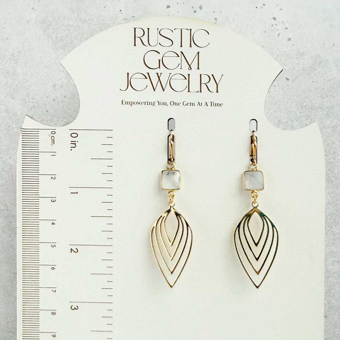 Gold earrings with a &