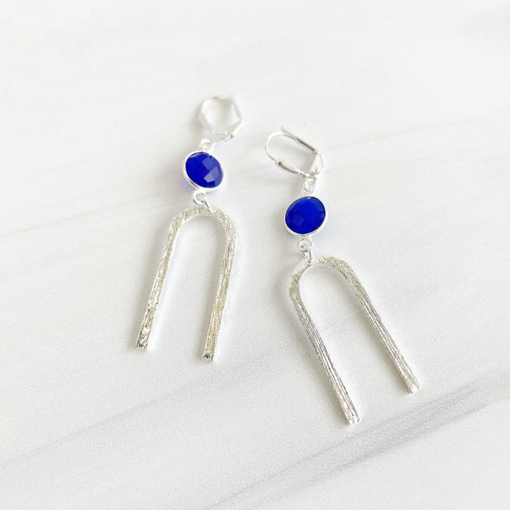 Blue Stone and Horseshoe Dangle Earrings in Brushed Silver