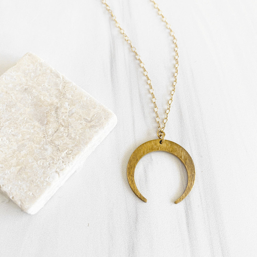 Brushed Brass Crescent Moon Necklace in Gold