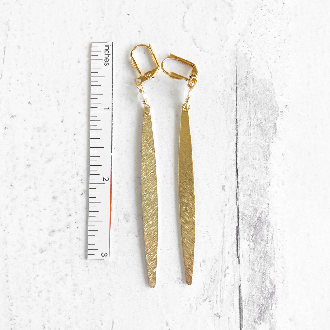 Long Stick Earrings in Brushed Gold with Clear Quartz Beads