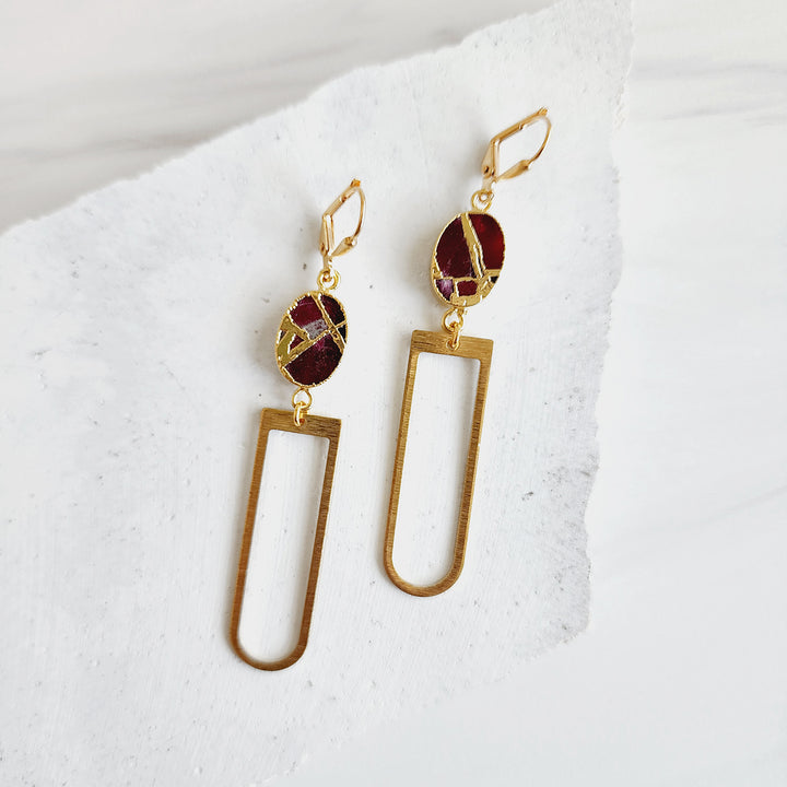 Horseshoe Dangle Earrings with Oval Mojave Stone in Brushed Gold
